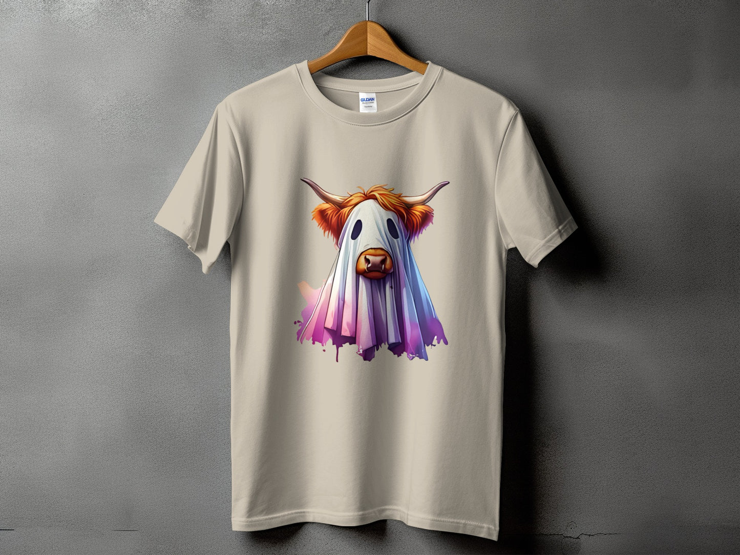 T-shirt with a ghost cow graphic featuring watercolor splash accents.