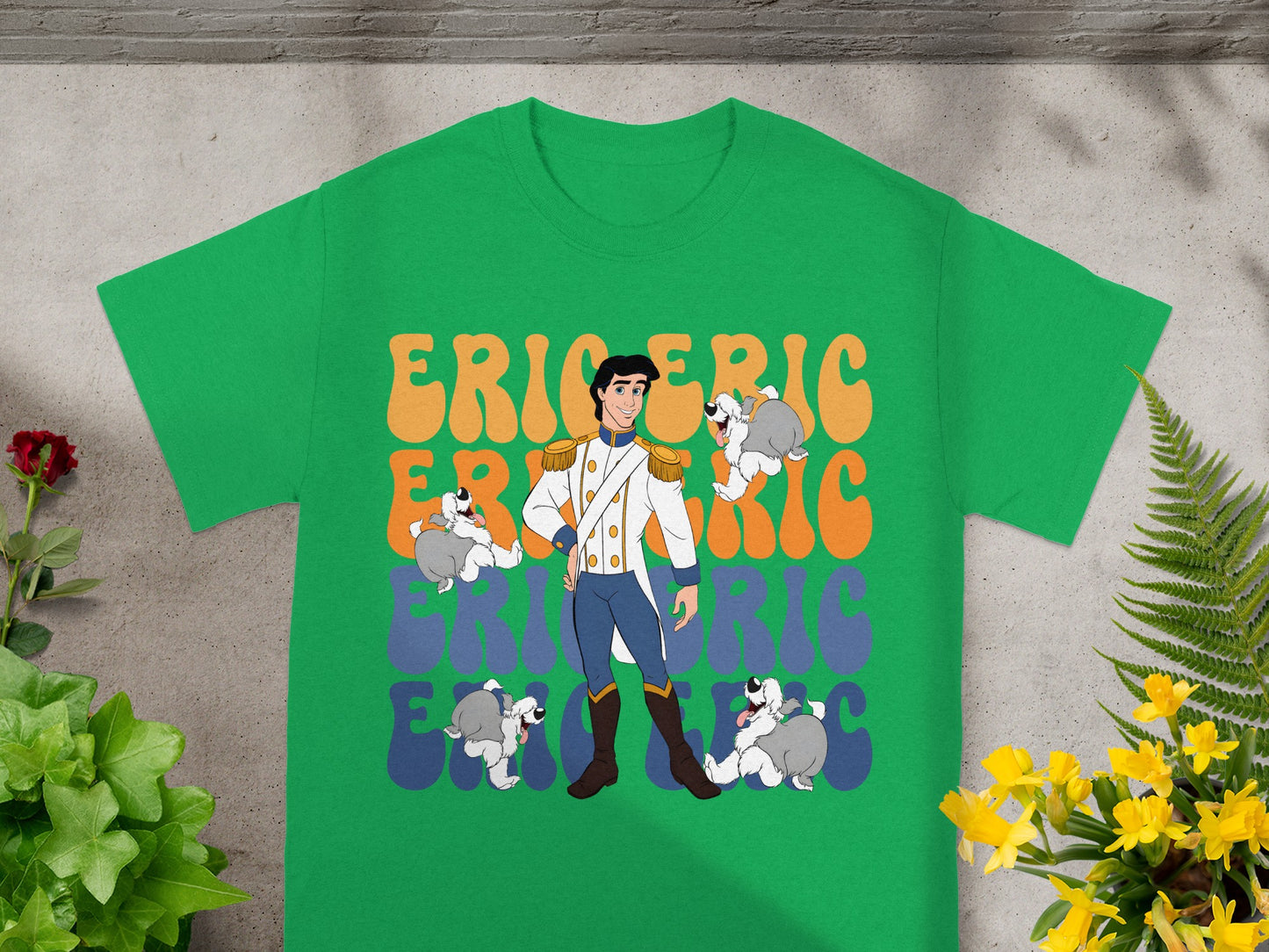 Prince Eric and dogs graphic on a green t-shirt.
