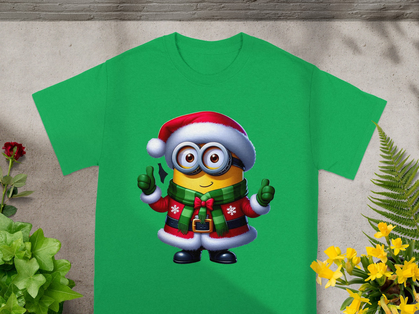Green t-shirt with Minion in Santa hat and winter coat giving thumbs up.