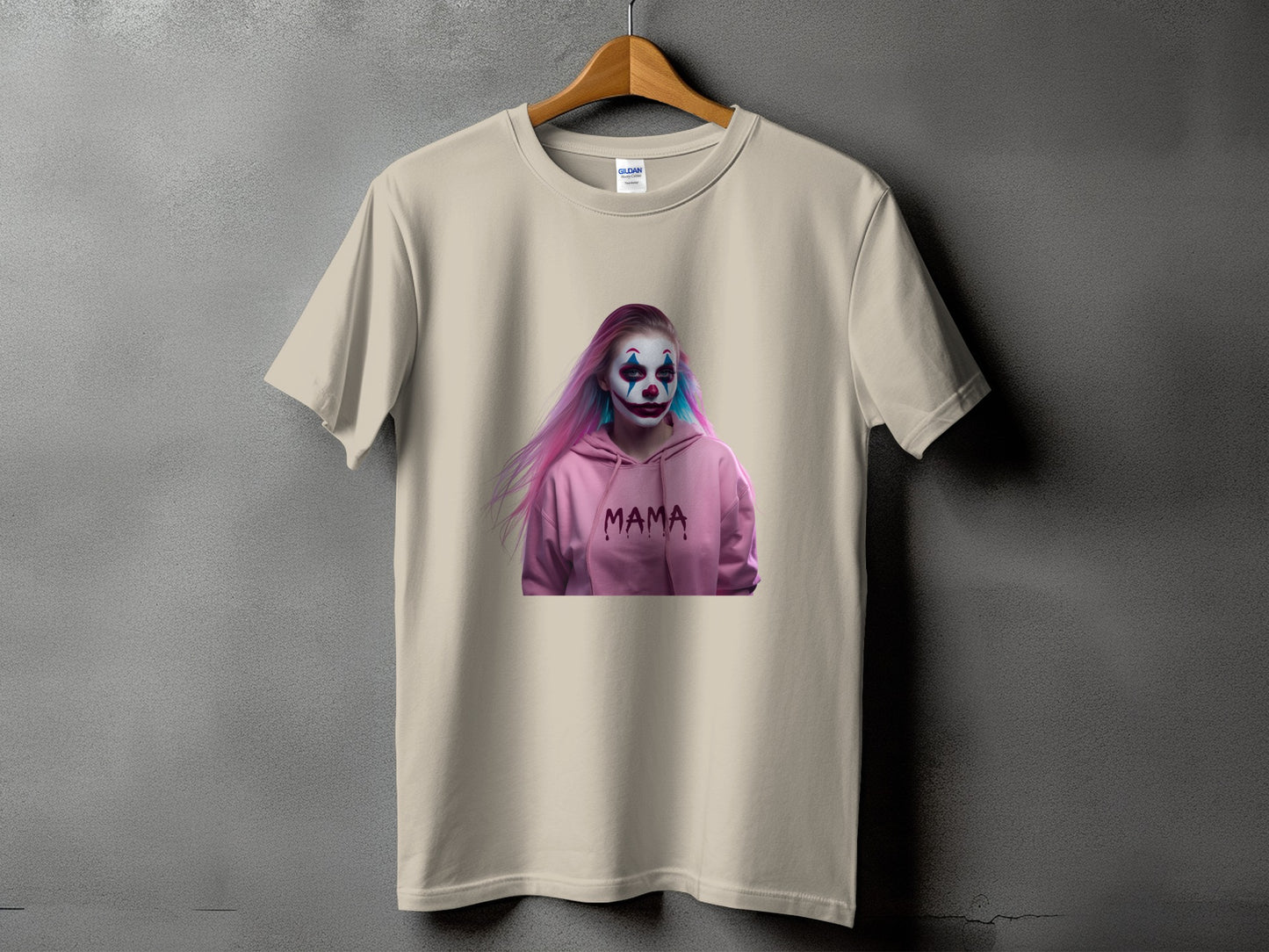 Cream t-shirt with a girl in clown makeup and pink hair wearing a pink hoodie with "MAMA" text.
