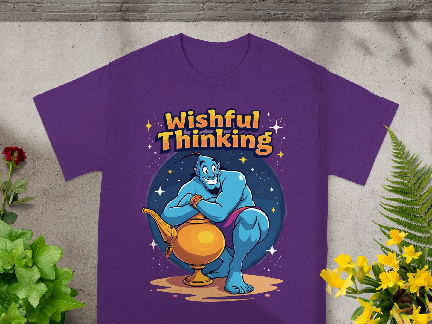 Genie with lamp on purple t-shirt, "Wishful Thinking" text.