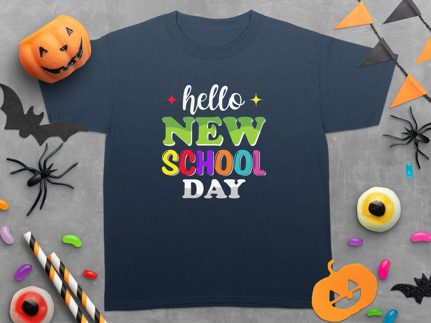 Navy t-shirt with "hello NEW SCHOOL DAY" text and Halloween decorations.