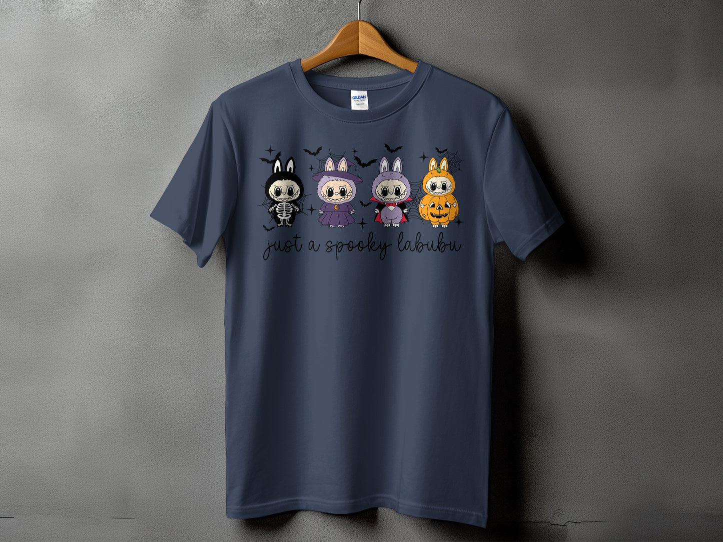 Dark blue t-shirt with four cute Halloween characters and "just a spooky labubu" text.