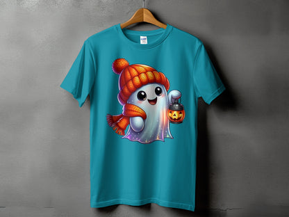Turquoise t-shirt featuring a cartoon ghost wearing a hat and scarf, holding a jack-o'-lantern.
