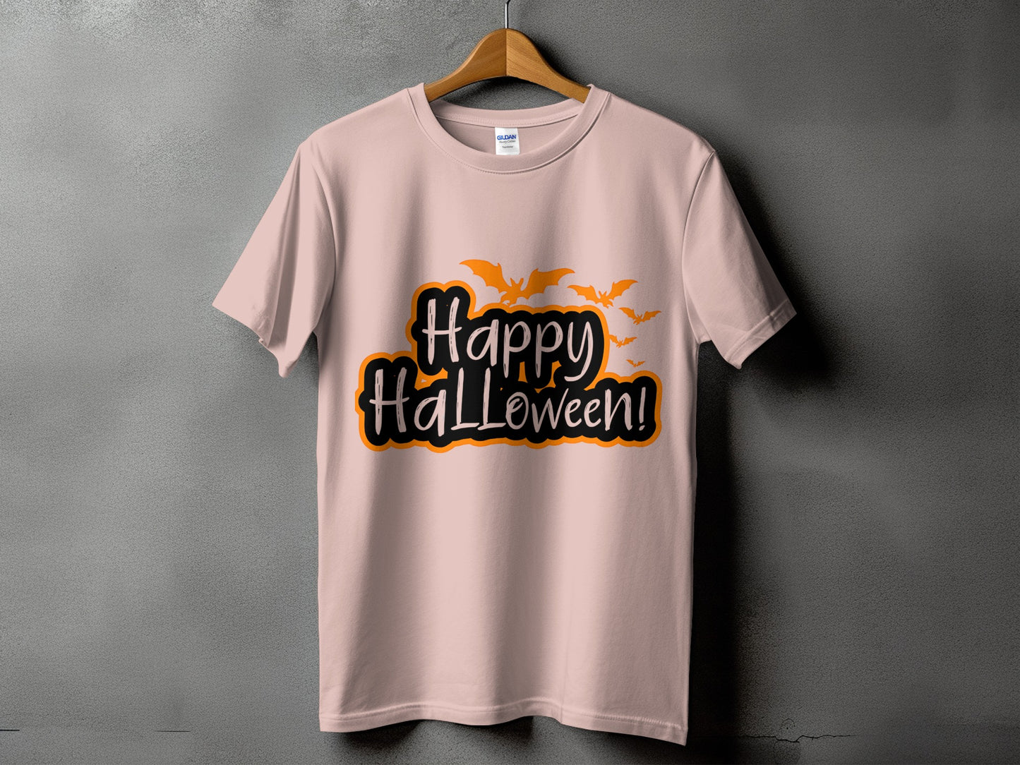Pink t-shirt with "Happy Halloween!" text and flying bats graphic.