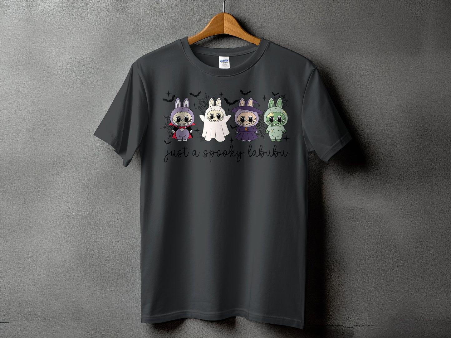 Dark gray t-shirt with four cute Halloween characters and text "just a spooky labubu".