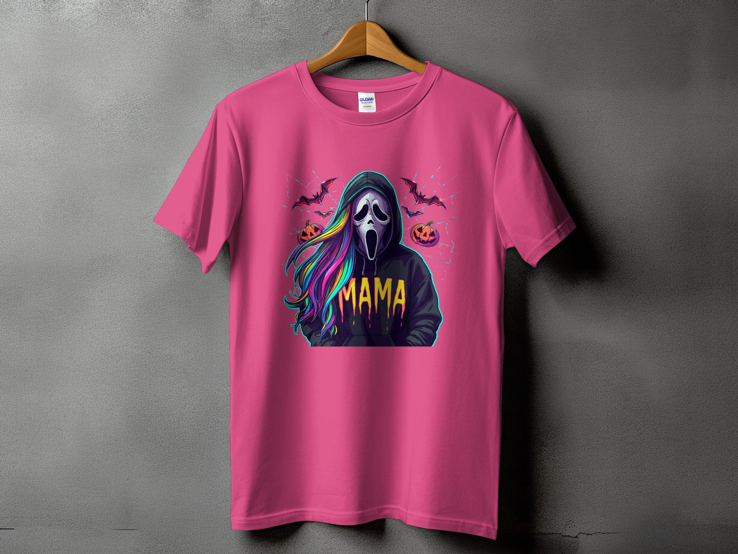 Pink t-shirt with Scream mask, colorful hair, bats, and pumpkins graphic saying "Mama".