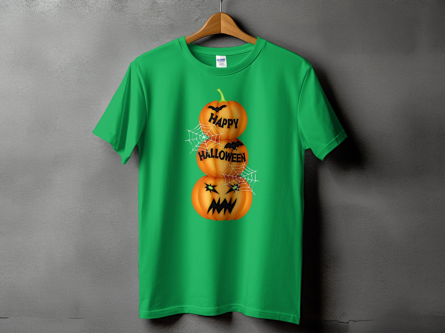 Green t-shirt with stacked pumpkins saying "Happy Halloween" and cobwebs.