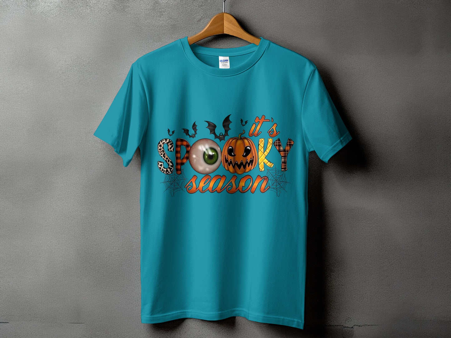 Turquoise t-shirt with "it's SPOOKY season" text and Halloween graphics.