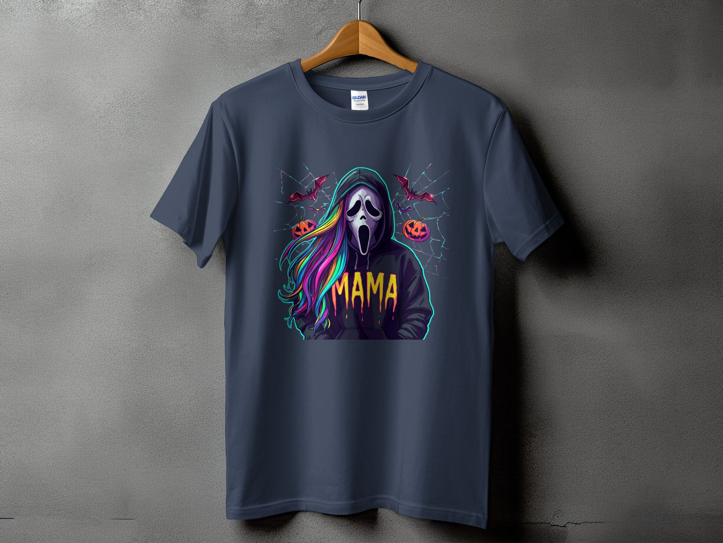 T-shirt featuring a Ghostface mask, colorful hair, and "MAMA" text, with bats and pumpkins.