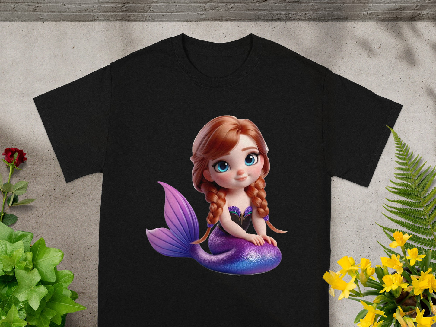 Black t-shirt with a cartoon mermaid graphic.