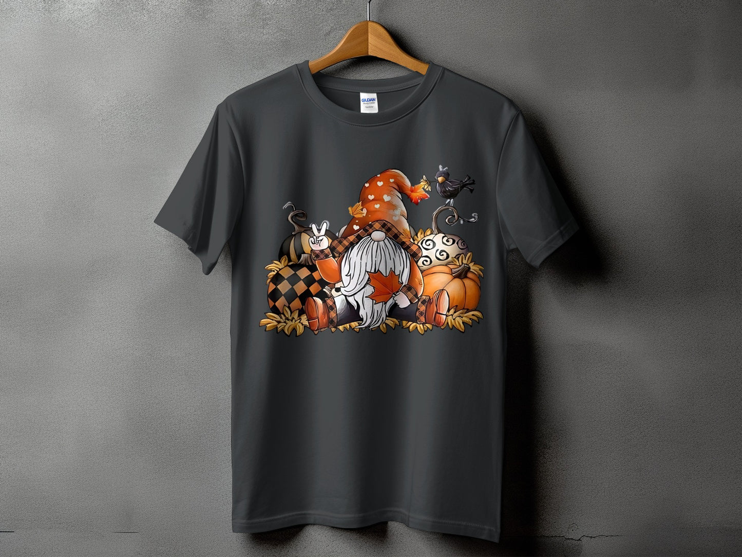 Dark gray t-shirt with a Fall gnome and pumpkin graphic.