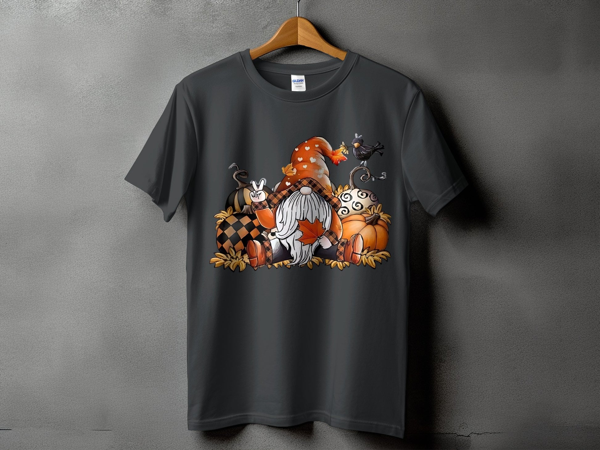 Dark gray t-shirt with a Fall gnome and pumpkin graphic.