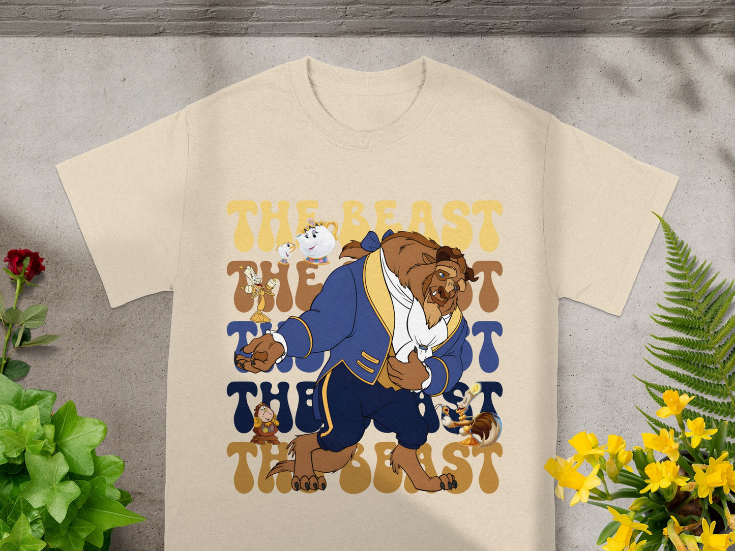 Beast and Lumiere from Beauty and the Beast on a cream t-shirt.