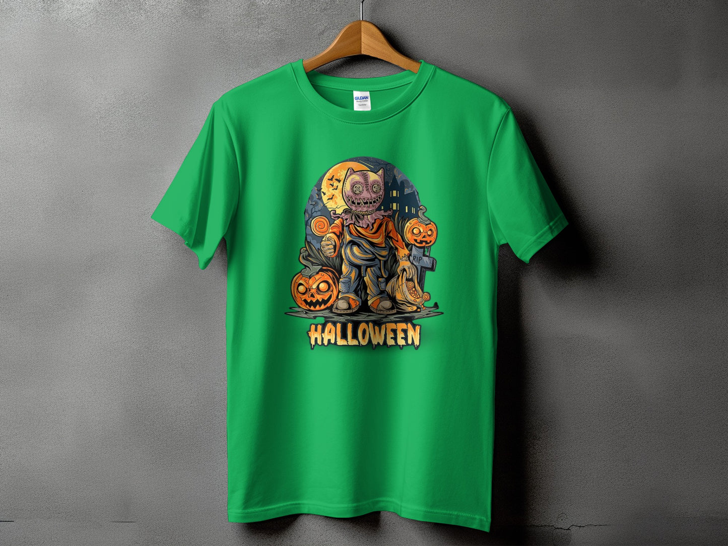 Green t-shirt with a Halloween graphic of a scarecrow and pumpkins.