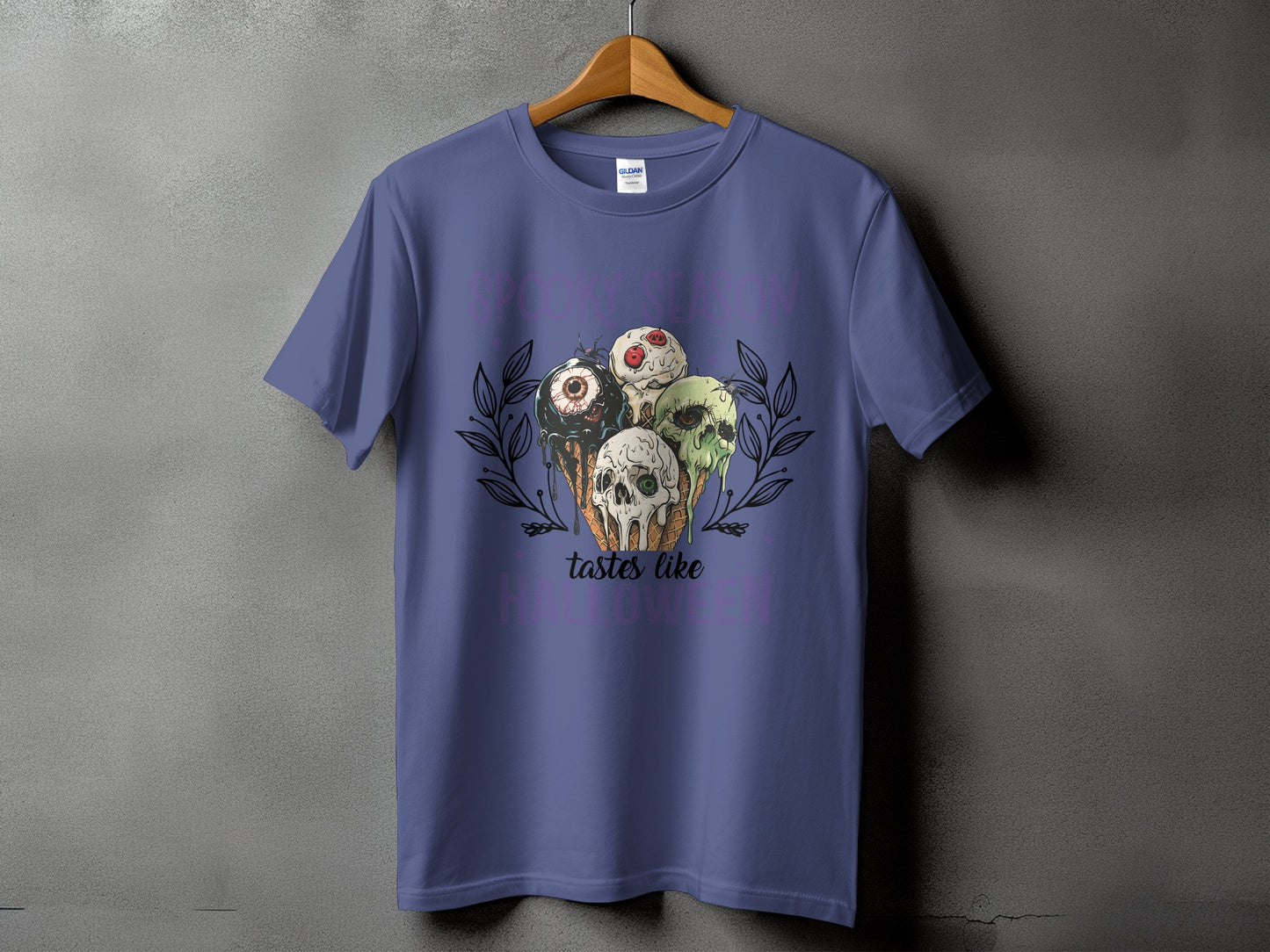 Purple t-shirt with Halloween ice cream cones featuring a skull, eye, and spiders.