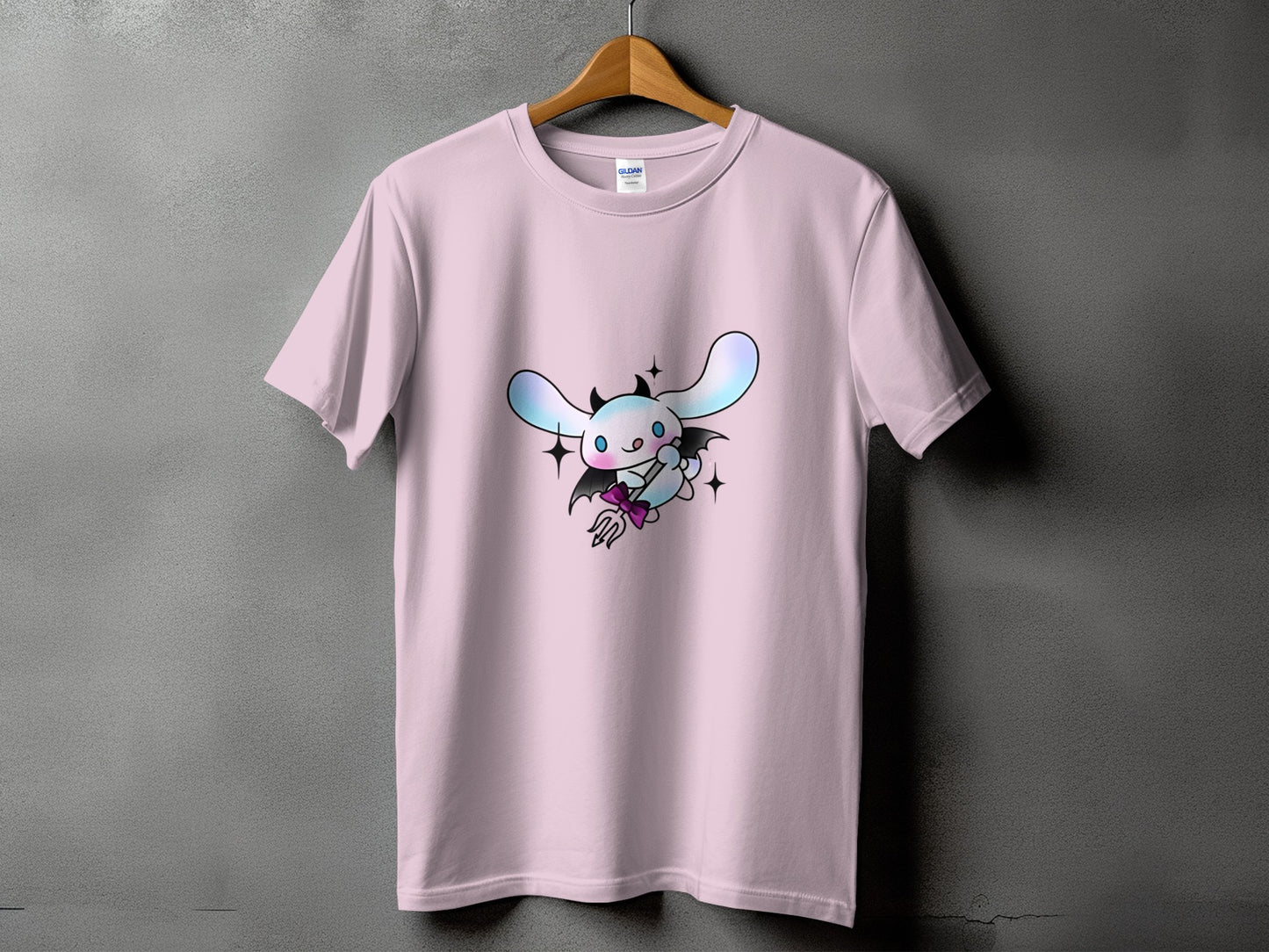 Pink t-shirt with a devilish bunny graphic holding a pitchfork.