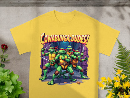 Teenage Mutant Ninja Turtles with "Cowabunga, dudes!" text on a yellow t-shirt.