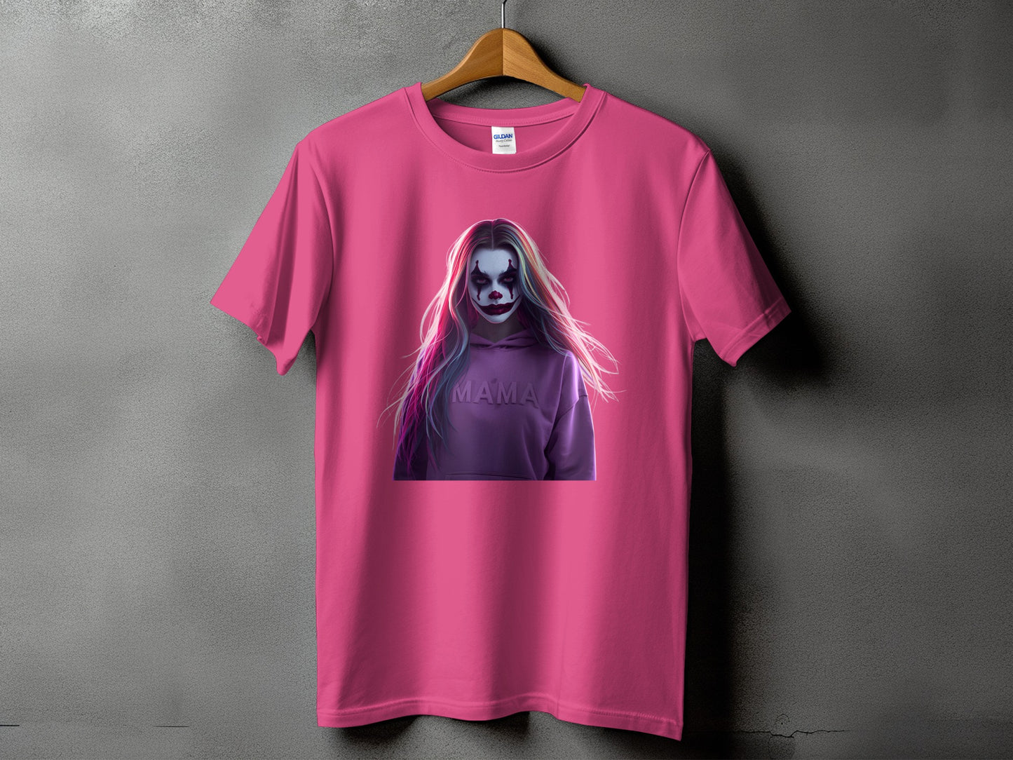 Pink t-shirt with graphic of a woman with clown makeup and "MAMA" text.