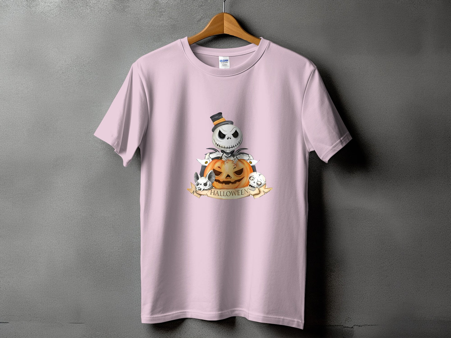 Pink t-shirt with Halloween graphic of Jack Skellington, pumpkin, and skulls.