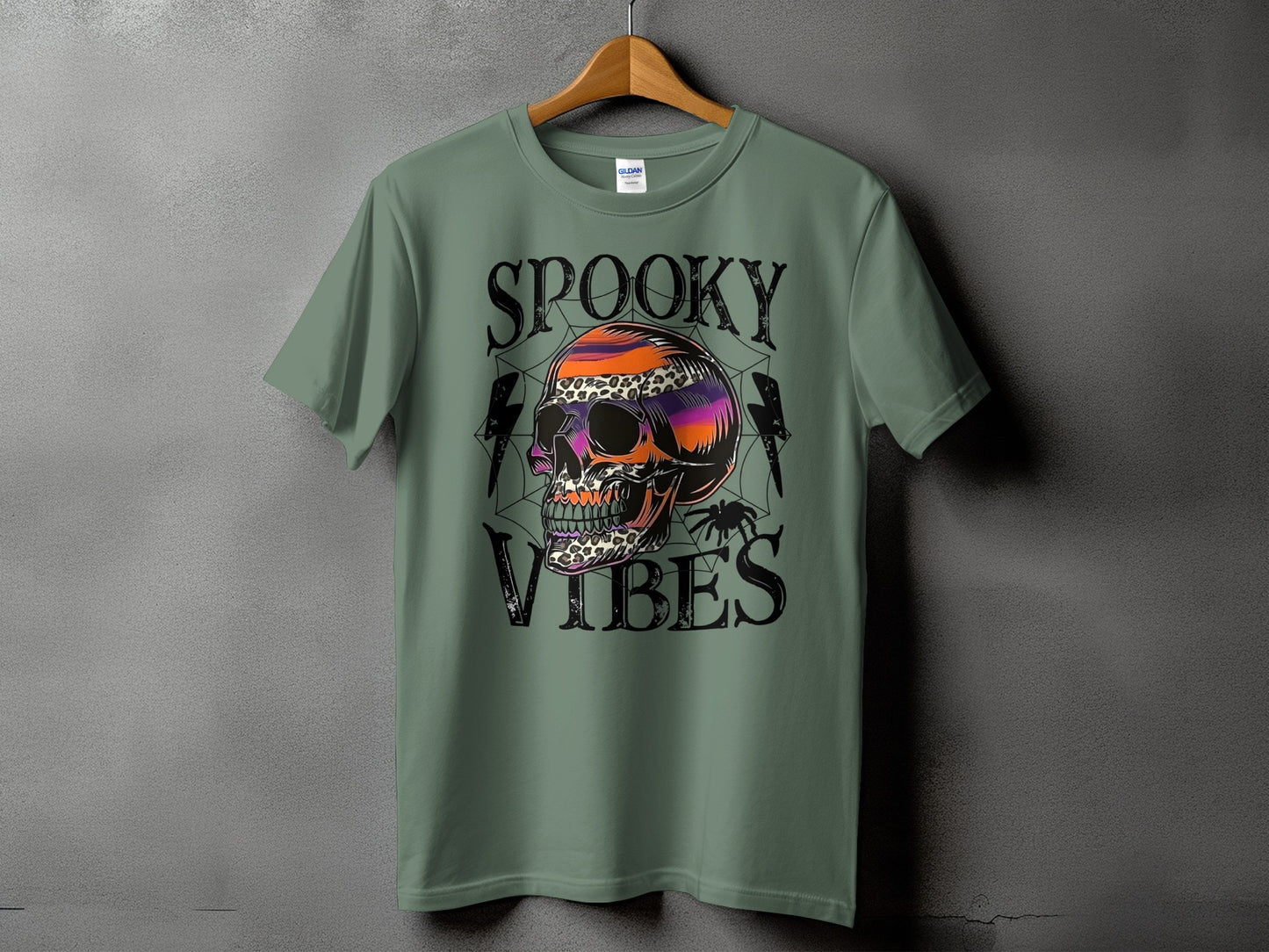 Green t-shirt with "Spooky Vibes" text and a skull graphic.