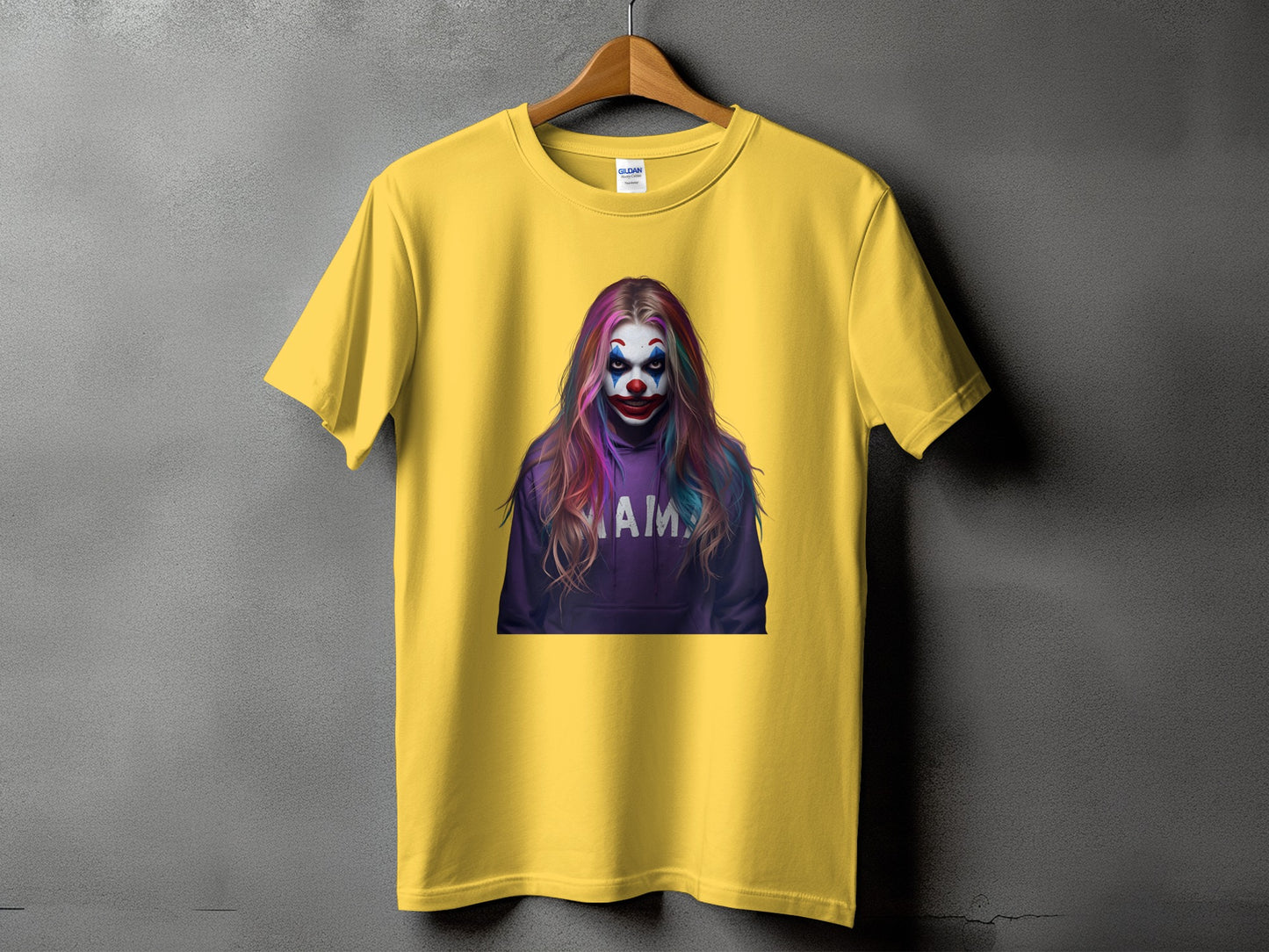 Yellow t-shirt featuring a colorful clown graphic with the word "AMAY" on a hoodie.