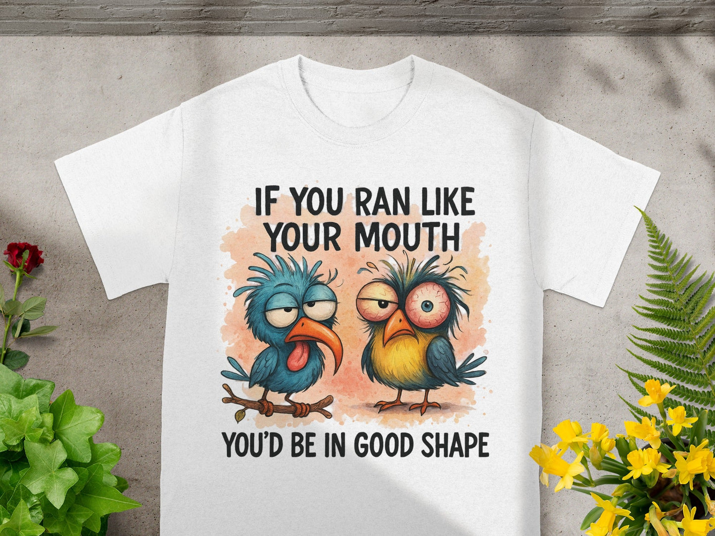 White t-shirt with cartoon birds and text "IF YOU RAN LIKE YOUR MOUTH YOU'D BE IN GOOD SHAPE".