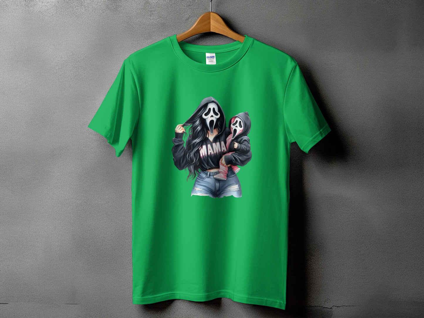 Green t-shirt with "MAMA" text and ghost-masked mother holding baby