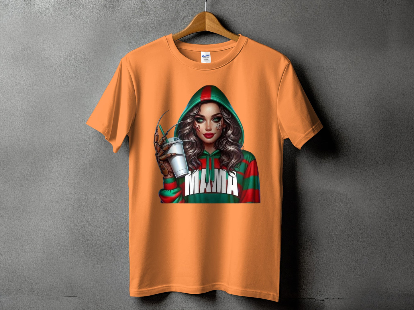 Orange t-shirt with graphic of a woman in a hooded sweater with "MAMA" text.