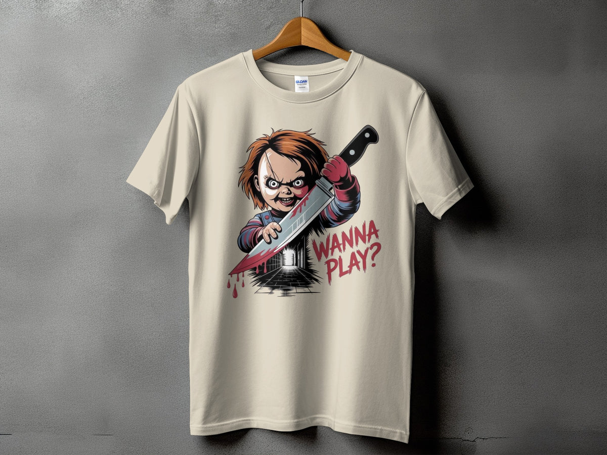 Chucky doll with bloody knife and "Wanna Play?" text on beige t-shirt.