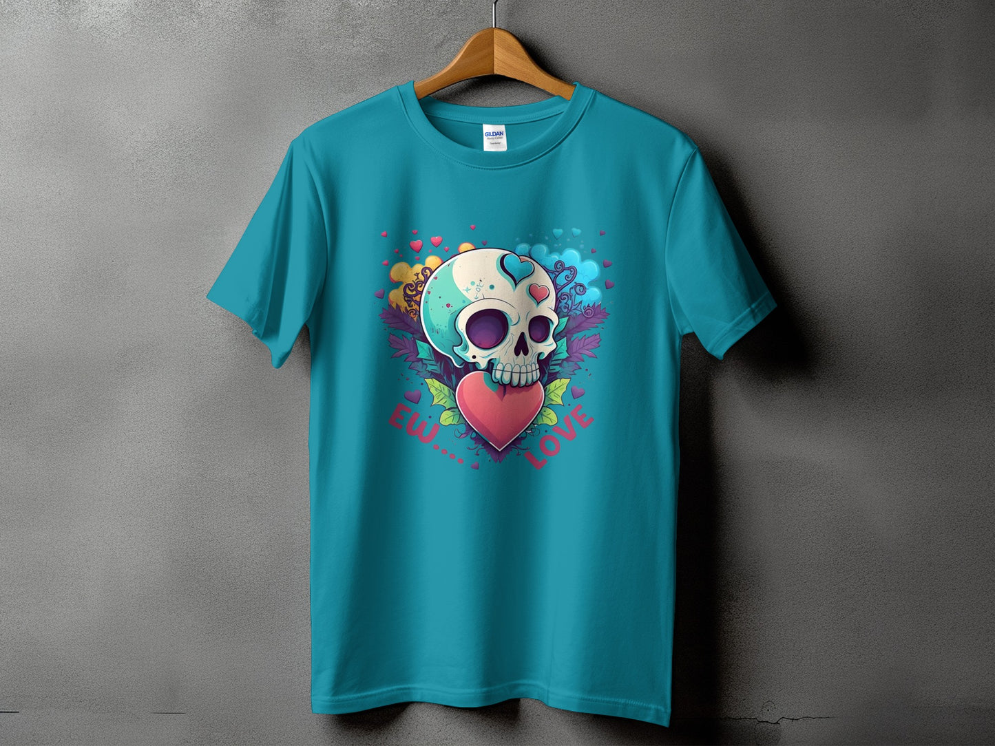 Turquoise t-shirt with a skull and heart graphic that reads "Be My Love".