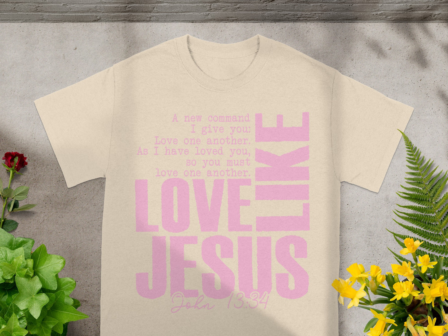 T-shirt with pink text "LOVE LIKE JESUS" and John 13:34.