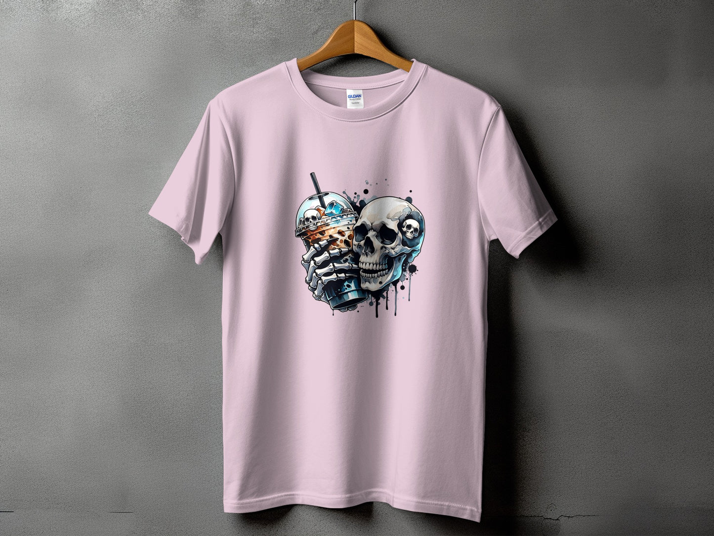 Pink t-shirt with graphic of a skull holding a coffee cup.