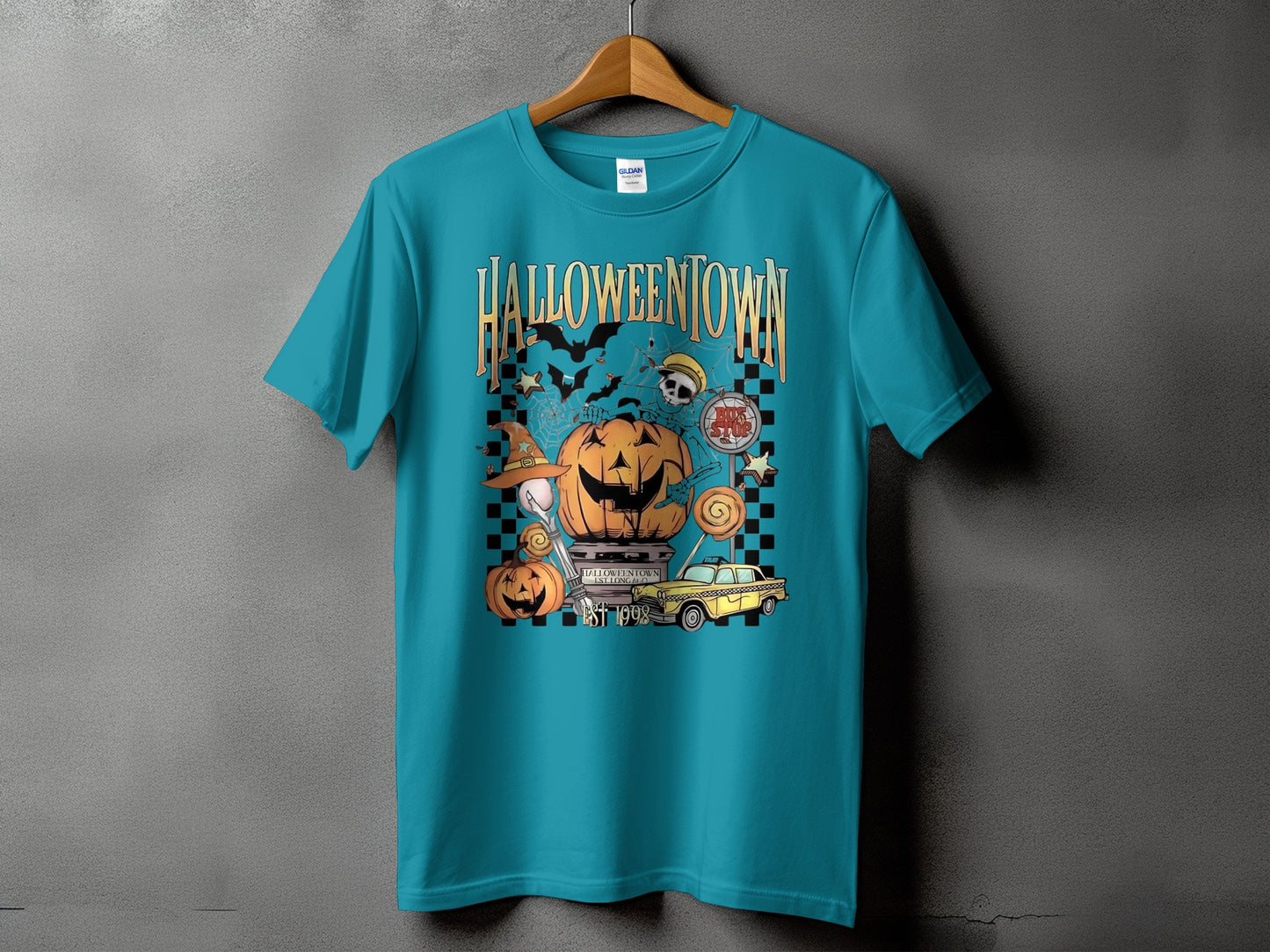 Teal t-shirt with "Halloweentown Est 1998" Halloween graphic and yellow taxi.
