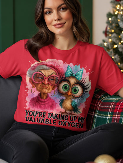 Woman wearing a red t-shirt with a cartoon owl and quote.