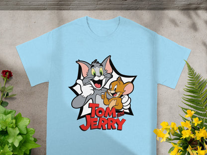 Light blue t-shirt with Tom and Jerry cartoon characters celebrating.