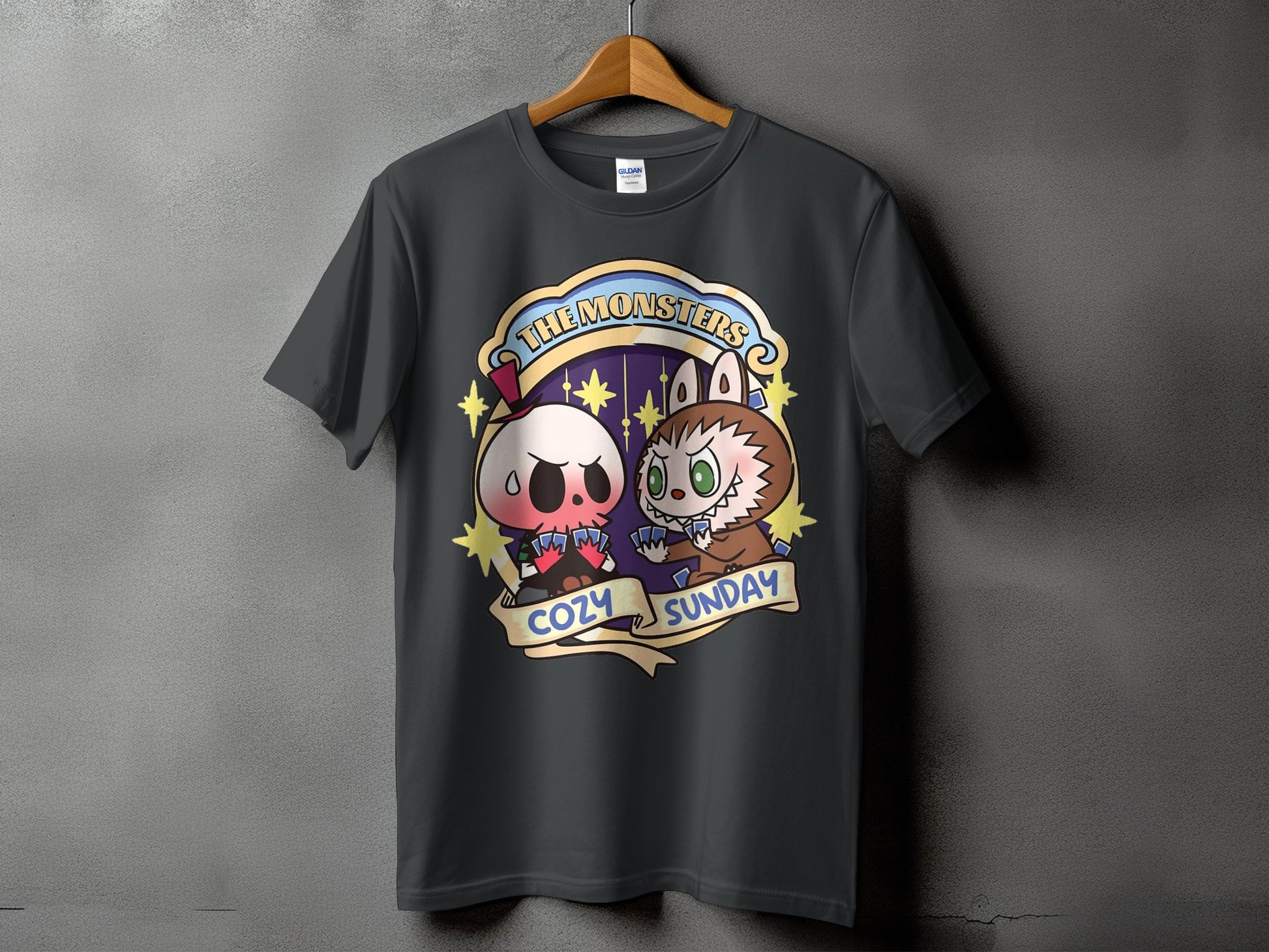 Dark gray t-shirt featuring cartoon skull and werewolf characters with "The Monsters Cozy Sunday" text.
