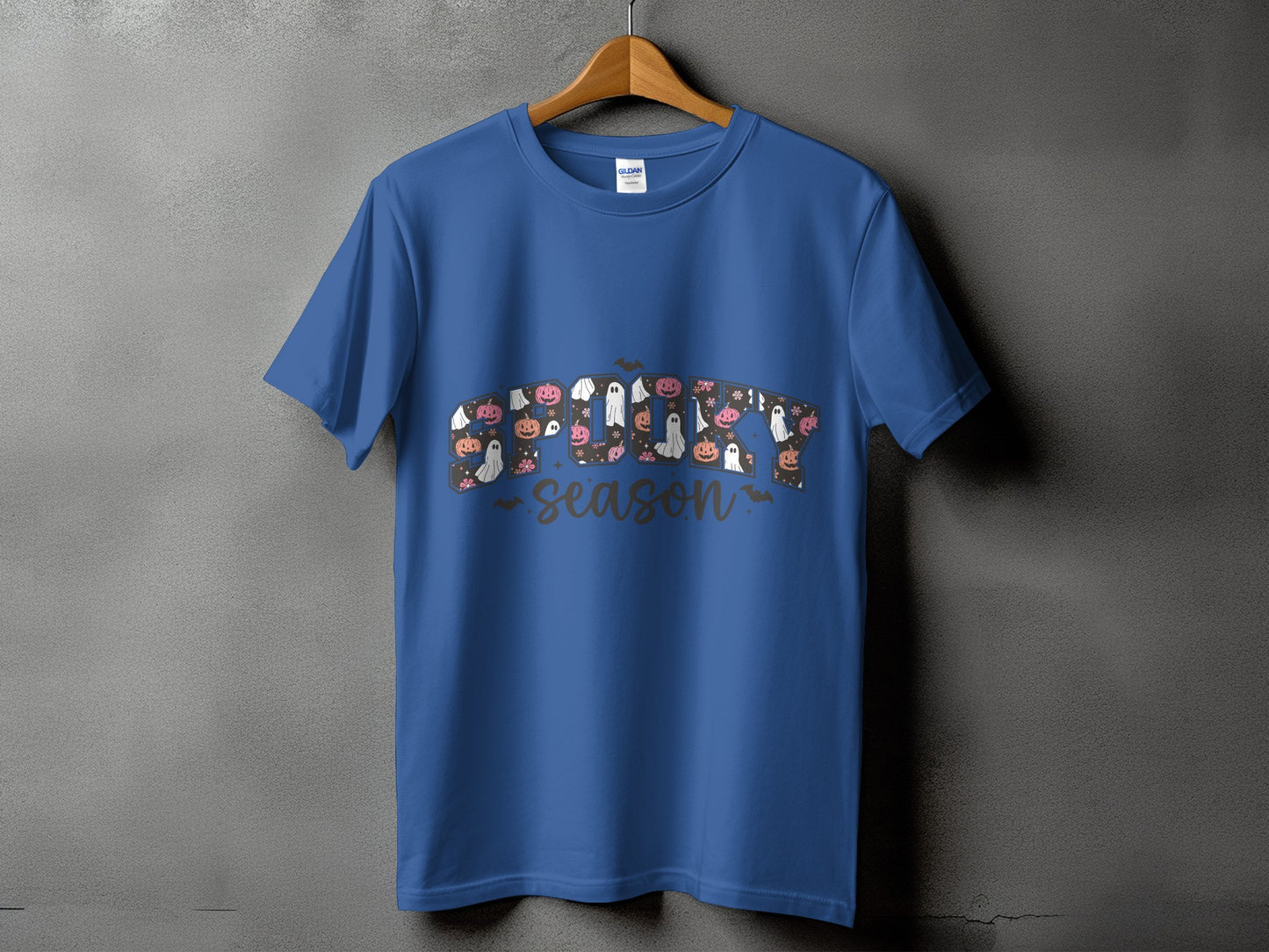 Blue t-shirt with "Spooky Season" graphic featuring pumpkins and ghosts.