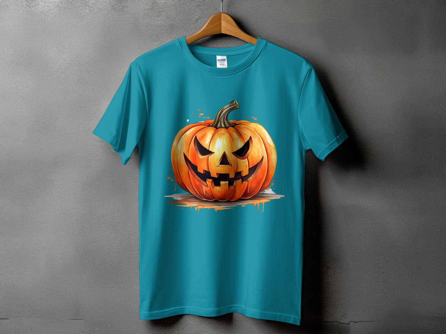 Teal t-shirt featuring a carved, glowing jack-o'-lantern with splatter effects.