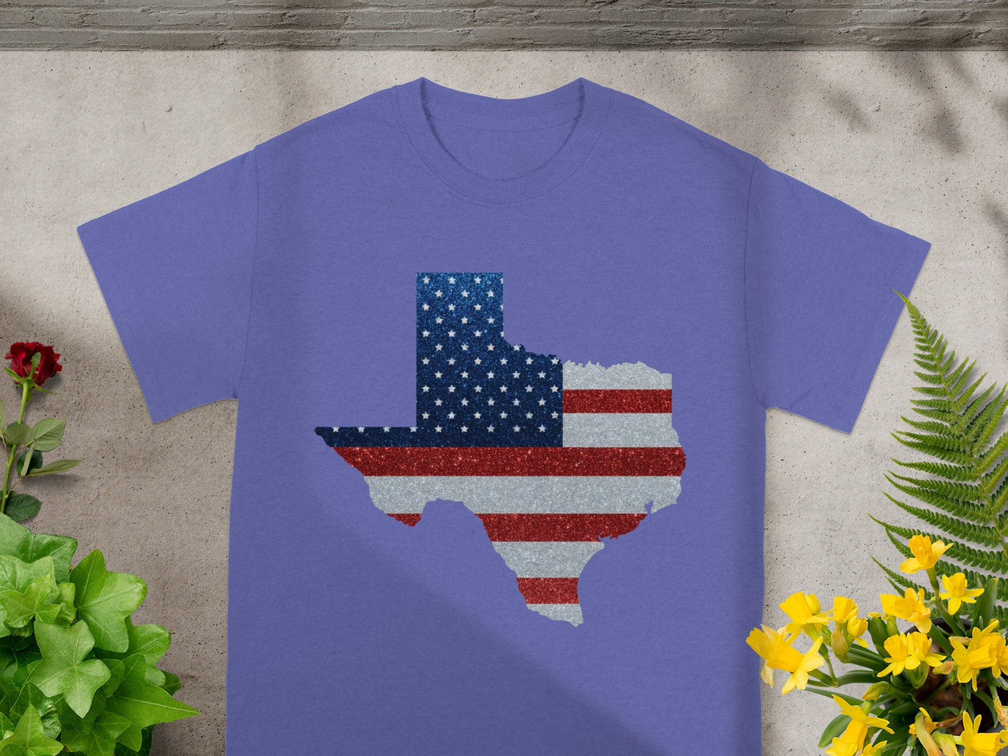 Purple t-shirt with glitter Texas outline filled with American flag colors.