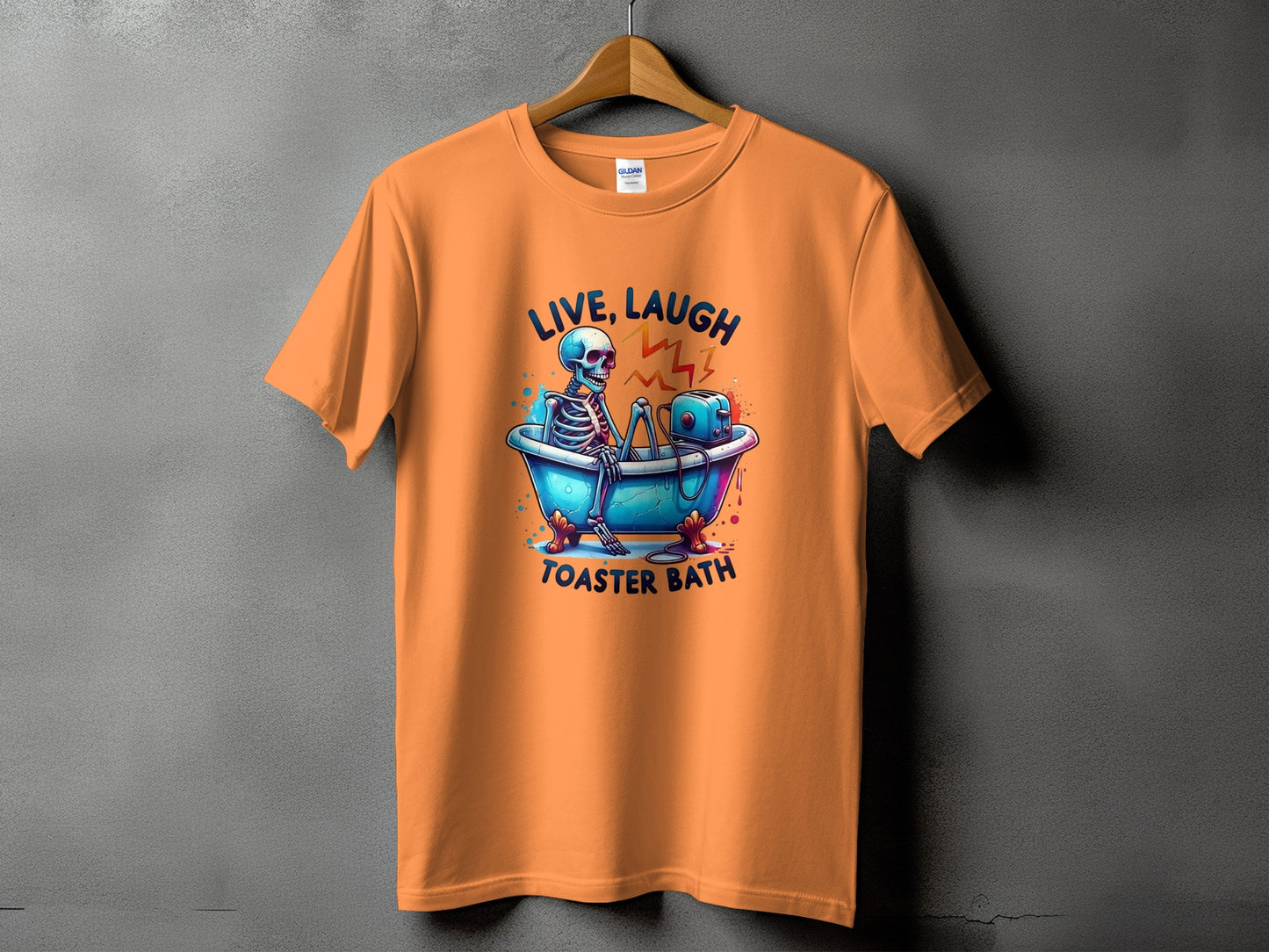 Orange t-shirt with skeleton in bathtub and toaster graphic and text.