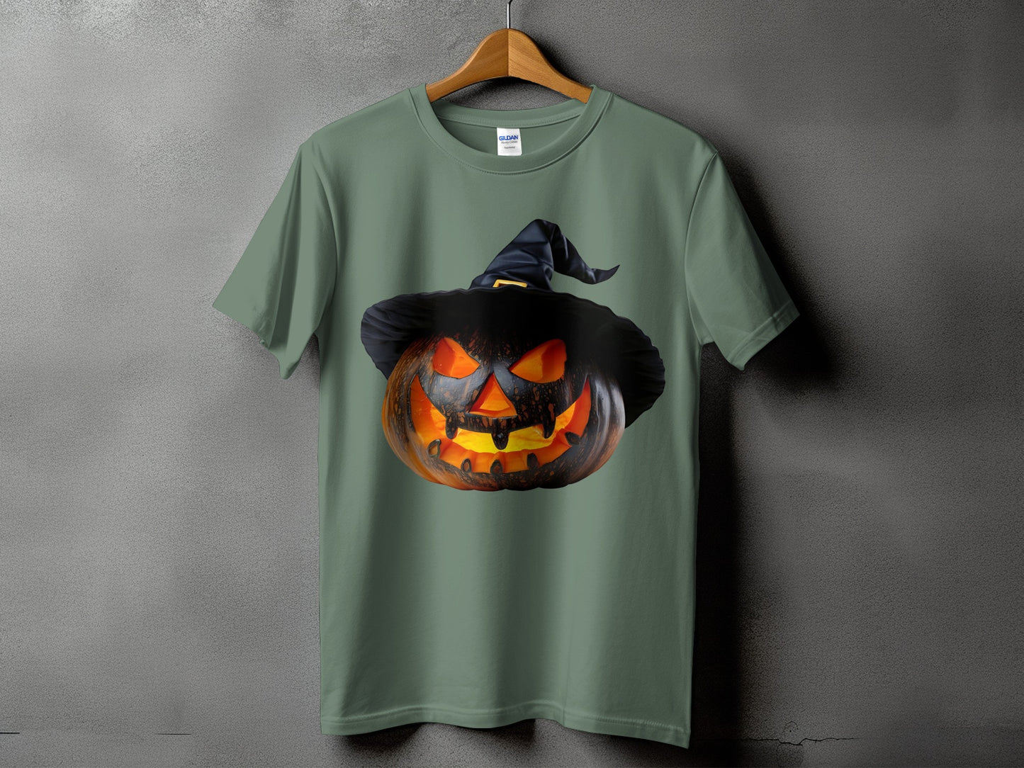 Green t-shirt with a carved jack-o'-lantern wearing a witch hat graphic.