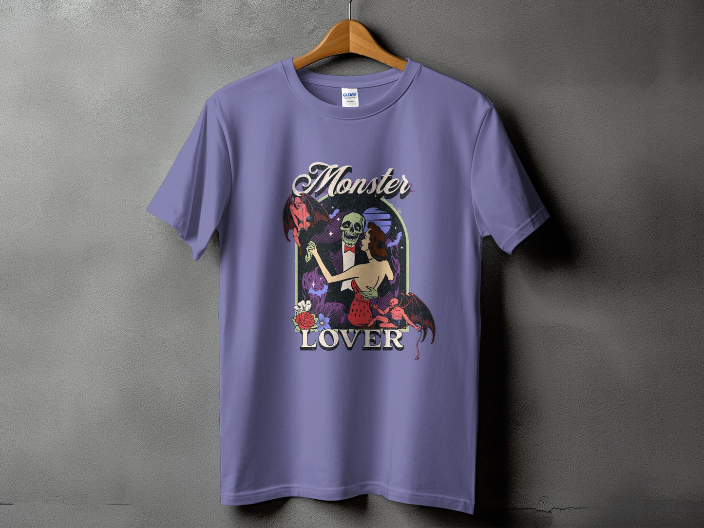 Lavender t-shirt with "Monster Lover" text and a dancing skeleton couple with bats.