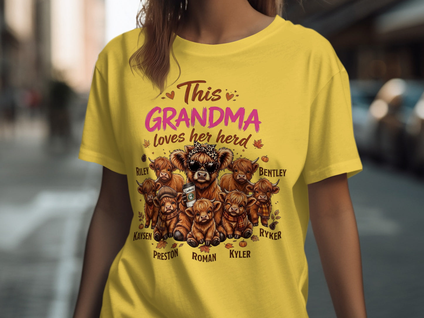 Yellow t-shirt with "This Grandma loves her herd" and Highland cows named Riley, Bentley, Kaysen, Preston, Roman, Kyler, and Ryker.
