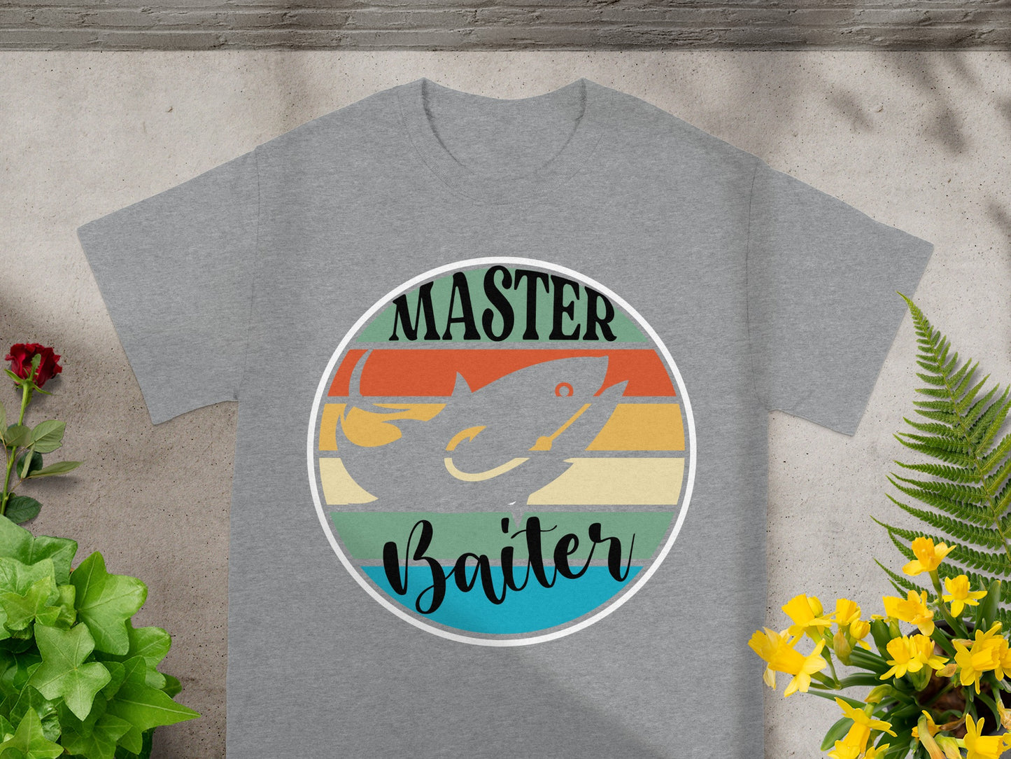 Grey t-shirt with circular "MASTER Baiter" fishing graphic and retro sunset stripes.