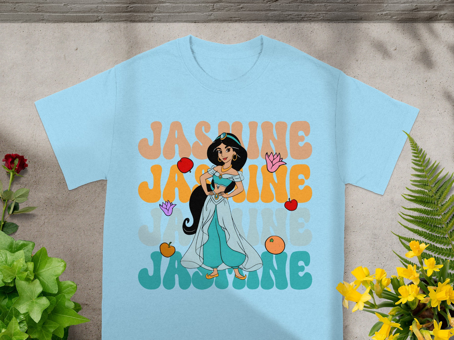 Light blue t-shirt with Jasmine text and character graphic.