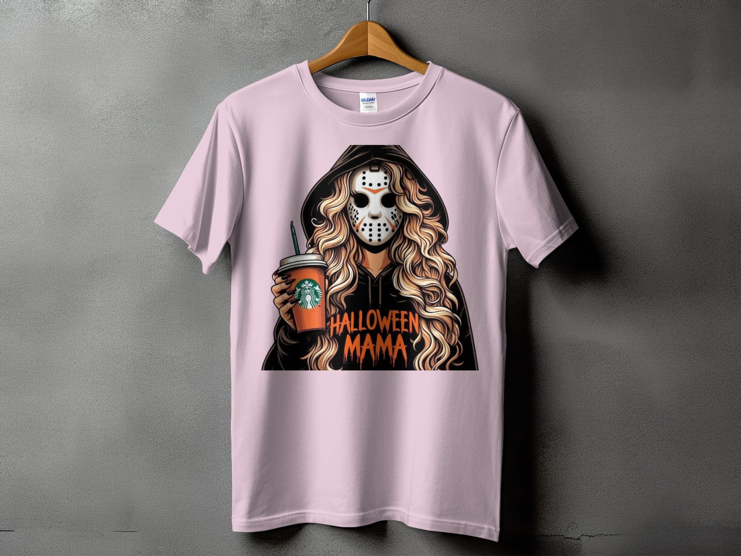 Pink t-shirt with graphic of woman in hockey mask holding coffee cup, text Halloween Mama.