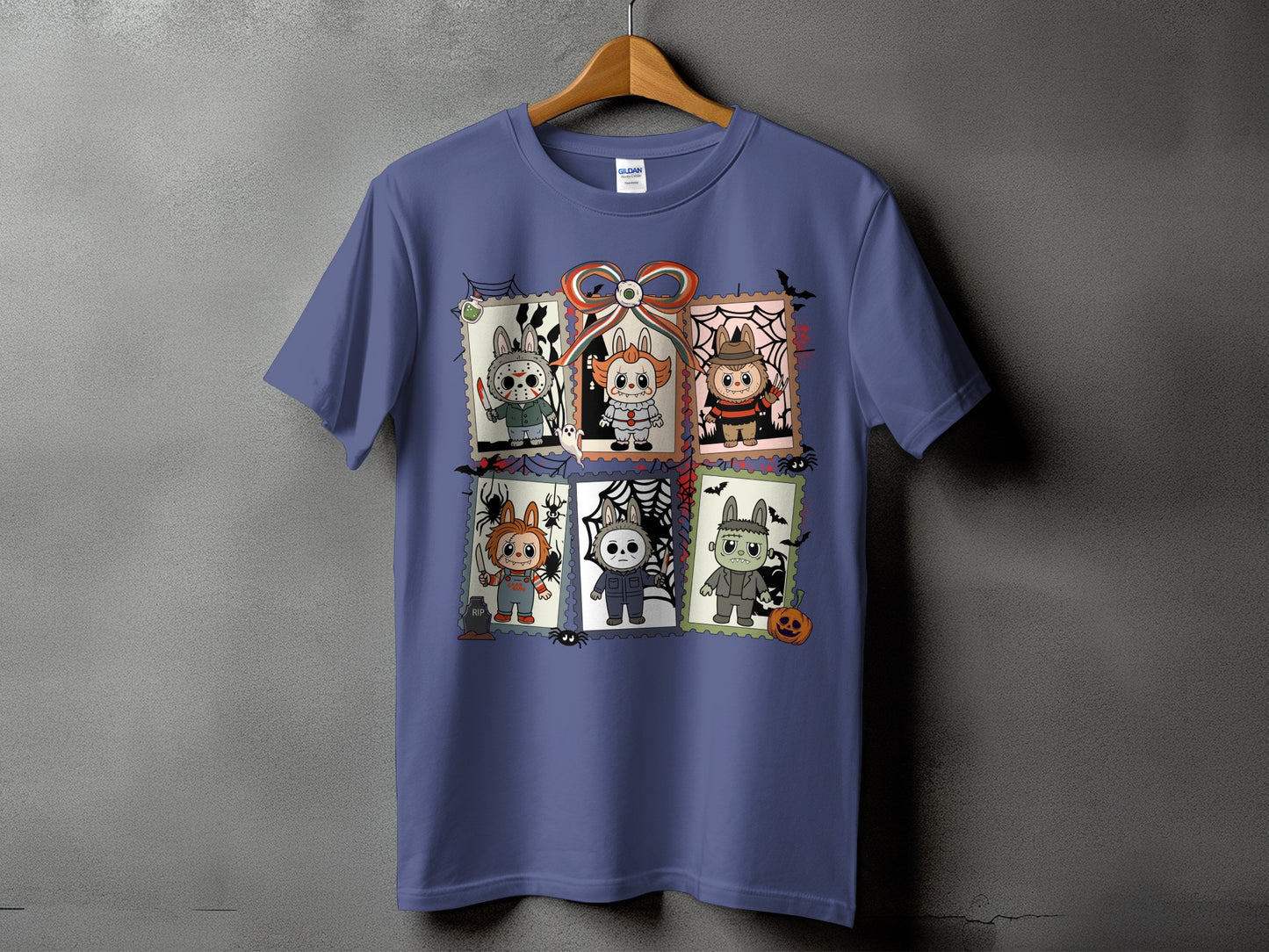 Purple t-shirt with six cartoon horror characters designed like postage stamps.