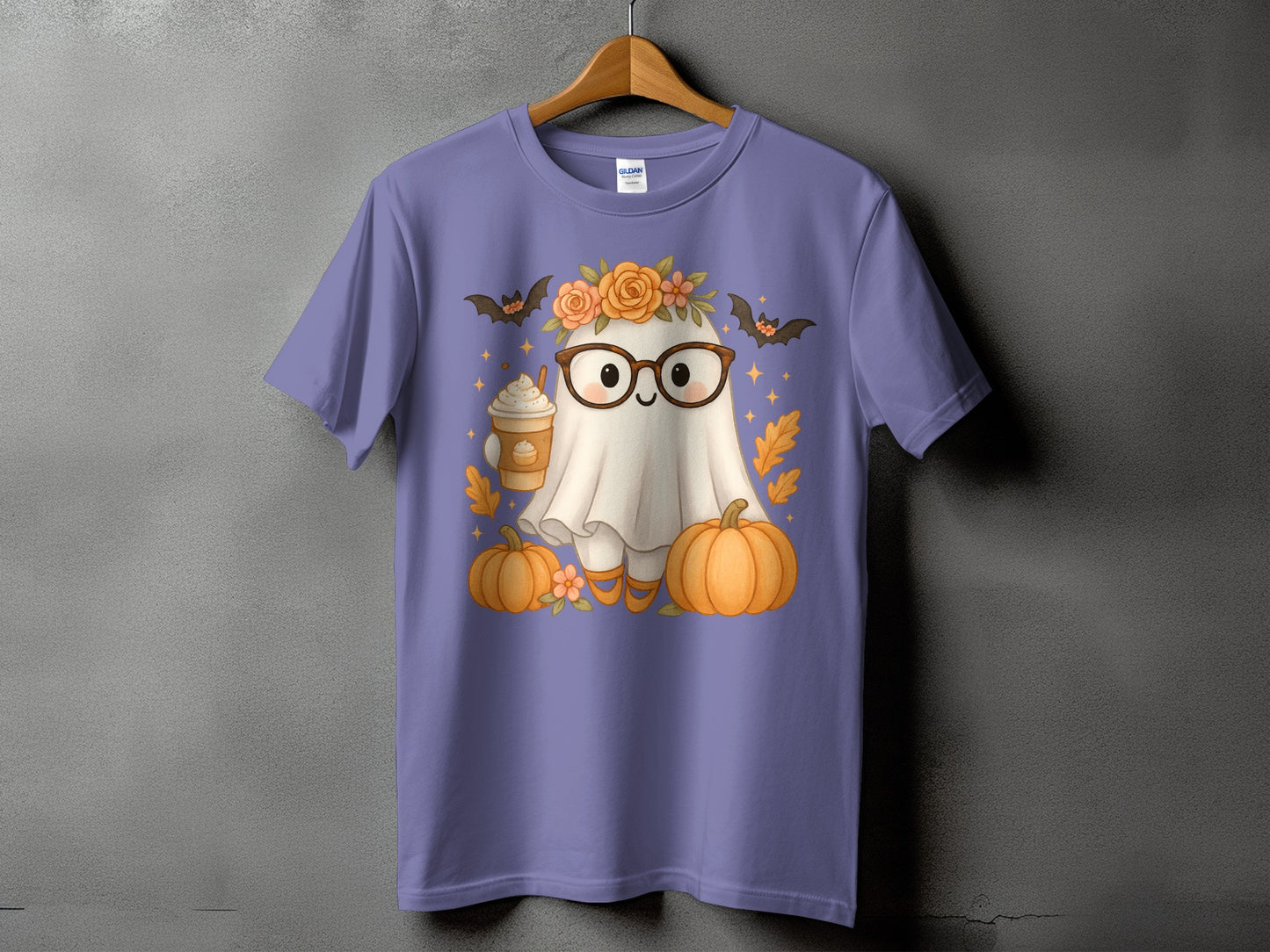 Ghost with glasses, floral crown, coffee, pumpkins, and bats on purple t-shirt.