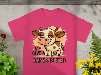 Pink t-shirt with cartoon cow and "MY D--- BUSTED" text.